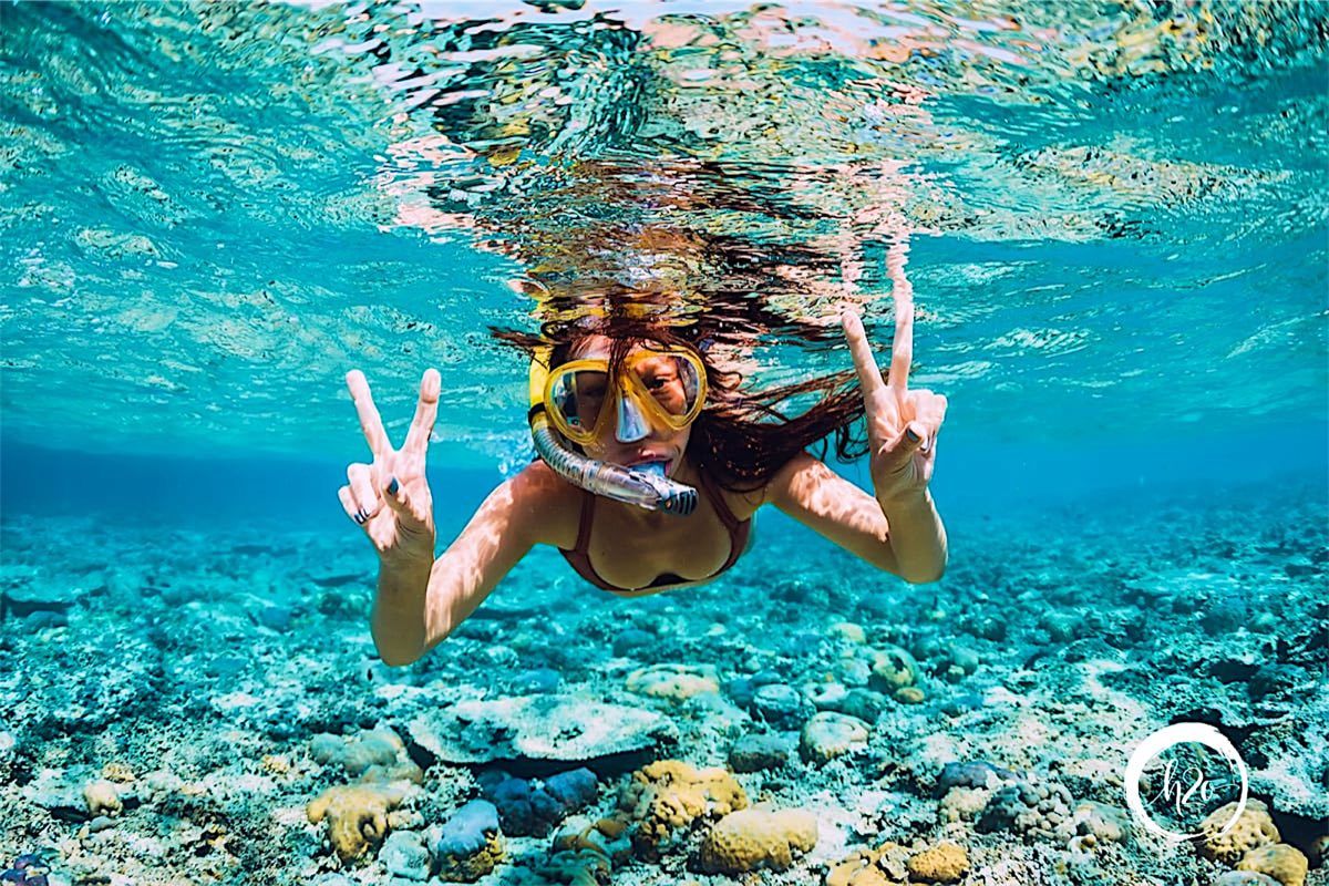 Snorkeler over the reef
